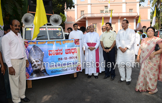 vehicle rally carrying the  statue of Pope John Paul II